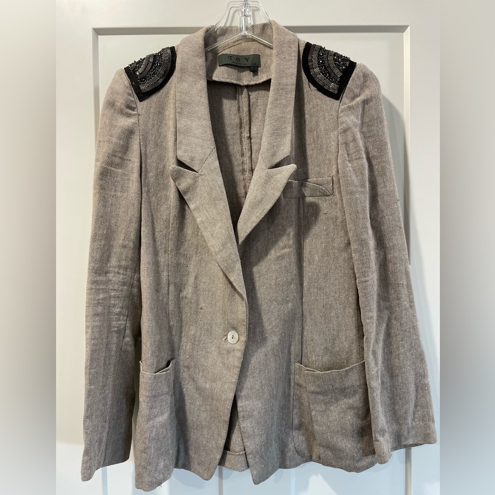 Gray blazer with beaded shoulder details.